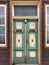 Vintage colorful entry door in aged wooden  house in Germany