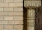 Vintage column made of embossed wood near brick wall in Madrid, Spain. Authentic Valencian style