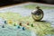 Vintage compass on a map of the USA. Selective focus, Magnetic compass and location marking with a pin on routes on world map, AI