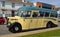 Vintage Cream and Green 1950 Duple bus parked in road.