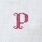 Vintage cross-stitch letter P on linen fabric