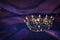 Vintage crown over dark royal purple delicate silk. fantasy medieval period