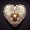 Vintage Crystal Heart with Intricate Carvings on Dark Purple Background