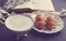 Vintage cup of cappuccino and croissants