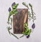 Vintage cutting board with herbs on wooden rustic background top view close place for text, frame