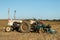 A vintage david brown white tractors with plough