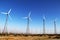Vintage desert wind farm retro turbines blue sky