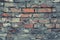 Vintage dilapidated cement brick wall grunge. Gray brick wall cement texture background. Vintage red brick wall grey background.