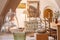 Vintage dining room corner with white walls, a rounded arch opening, a wooden table and chairs