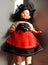 Vintage doll in a traditional costume (probably Swiss) bottom view