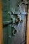 Vintage door locking mechanism of green wooden door