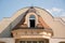 Vintage dormer and window on roof at house and sky