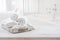 Vintage drawer with white towels over blurred bathroom and bedroom