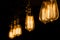 Vintage Edison Light Bulbs hanging against a black background