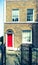 Vintage effect East London terrace home with red door.