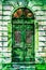 Vintage elaborate wooden door with green man
