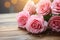 Vintage elegance Close up of gentle pink roses on rustic board