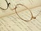 Vintage eyeglasses on a hand-written diary