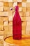 Vintage faceted medieval pink bottle of wine on a traditional winery table