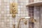 Vintage faucet and shower. Gold color in bath.