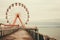 Vintage Ferris Wheel by the Ocean. Generative AI