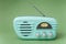 Vintage fifties style radio on green background