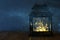 vintage filtered image of fairy lights inside old lantern