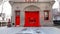 Vintage Firehouse in City bright red Doors & Brick wall