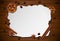 Vintage frame with cup of coffee, cinnamon, and biscuit on wooden table