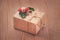 Vintage gift box, kraft paper, rope and holly berries on old wooden