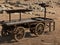 A vintage gold prospectors\\\' cart on wooden wheels stands in the steppe.