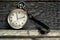 Vintage grandfather`s swiss pocket watch on the wooden boards