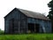 Vintage gray hay barn in Fingerlakes countryside during summer