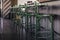 Vintage green bar stools stand in a row next to the bar counter. Horizontal frame