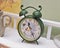 Vintage green colored clock. Retro alarm clock. Vintage clock.