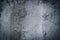 Vintage grey painted plaster concrete wall background. Dark edge