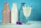 Vintage grunge style pink, white and blue milk bottles