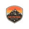 Vintage hand drawn mountain ski patrol emblem. Rescue team patch. Mountains stamp. Retro colors, grunge letterpress