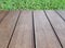 vintage hardwood patio floor with green grass lawn