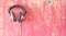 Vintage headphones hanging on grungy wall, listening,podcast, mu