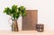 Vintage home decor composition with metal objects and green plan