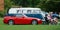 Vintage Honda S2000 VW Camper van with spectators sitting in chairs in front.