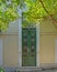 Vintage house entrance green tall door, Athens, Greece.