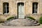 Vintage house wall with entrance door and windows