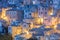 Vintage houses pattern background. Real picturesque small town in the evening illumination