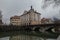 Vintage housing next to a bridge over Rinza river in Kocevje on a cold winter dull day