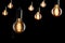 Vintage incandescent Edison type bulbs on black