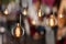 Vintage incandescent Edison type bulbs and window reflections