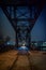 Vintage industrial railroad bridge at night