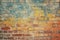 Vintage-inspired seamless pattern texture with a weathered yellow and red brick wall.